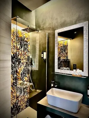 a bathroom with a sink and a mirror at Trastevere House B&B in Rome