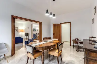 a living room with a table and chairs and a mirror at Bellavista - Family&Friends big House-Saint Peter in Rome