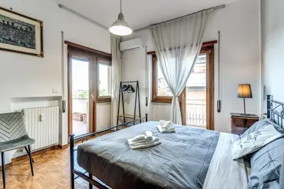 a bedroom with a bed with towels on it at Bellavista - Family&Friends big House-Saint Peter in Rome