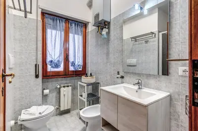 a bathroom with a white sink and a toilet at Bellavista - Family&Friends big House-Saint Peter in Rome