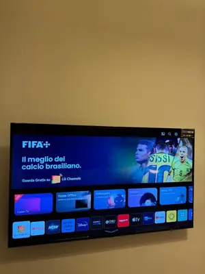 a flat screen tv on a wall at San Pietro Prestige Rooms in Rome
