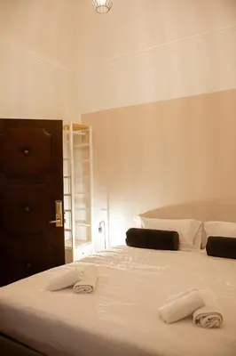 a bedroom with two beds with towels on them at San Pietro Prestige Rooms in Rome