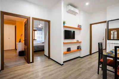 a room with a bedroom and a bed and a television at My Vatican Home in Rome in Rome