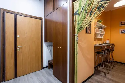 a corridor with a door and a bar in a room at My Vatican Home in Rome in Rome