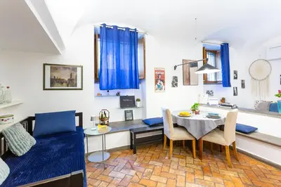 a living room with a table and a dining room at BBB House in Rome