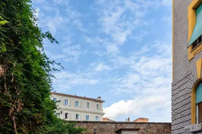 a white building with a blue sky in the background at BBB House in Rome