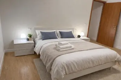 a bedroom with a large bed with towels on it at CASA DEL SOLE in Rome