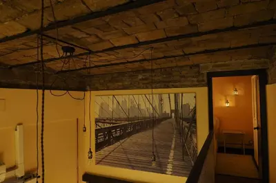 a room with a view of a wooden bridge at Loft Germanico in Rome