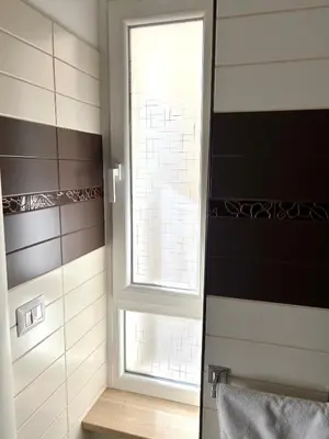 a bathroom with a window and a sink at Aurelia House Garden in Rome