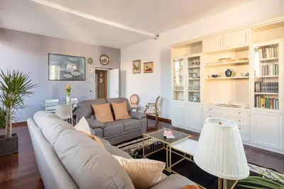 a living room with a couch and a table at Stunning Center Rome Apartment in Rome