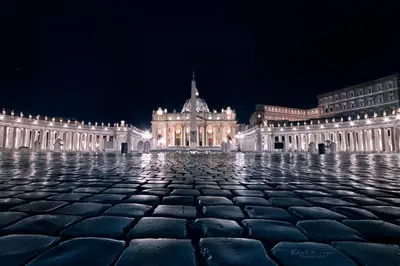 a large building at night with a cobblestone plaza at St. Peter's Balloon a due passi da San Pietro! in Rome