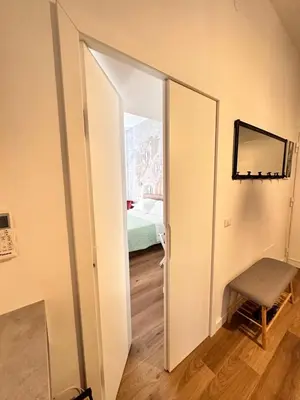 an open door to a bedroom with a bed at St. Peter's Balloon a due passi da San Pietro! in Rome