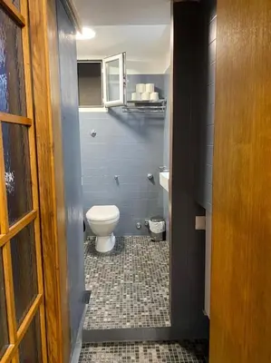a bathroom with a toilet and a sink at Casa Vicolo Moroni - Trastevere in Rome