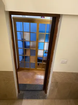 a door to a room with a glass door at Casa Vicolo Moroni - Trastevere in Rome