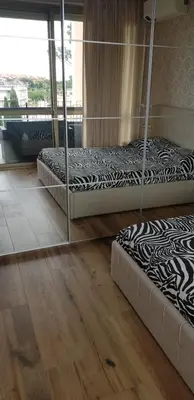 a living room with a glass table and a couch at Green Oasis in Rome