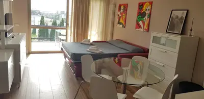 a living room with a couch and a table at Green Oasis in Rome