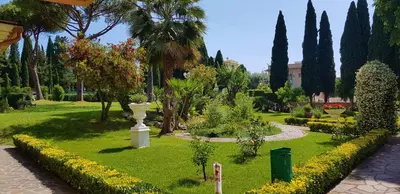 a kitchen and a living room with a table and chairs at Green Oasis in Rome