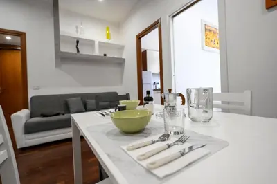 a kitchen with a table with a green bowl on it at Casa Angelico in Rome