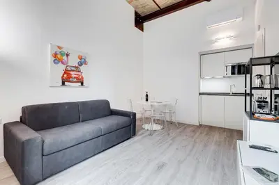 a living room with a couch and a table at Inner House 3 in Rome