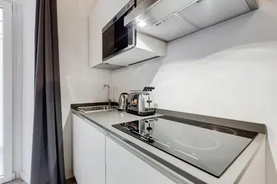 a kitchen with a sink and a microwave at Inner House 3 in Rome