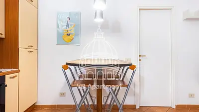 a kitchen with a table with a cage on it at Vatican-Balduina Apartment in Rome