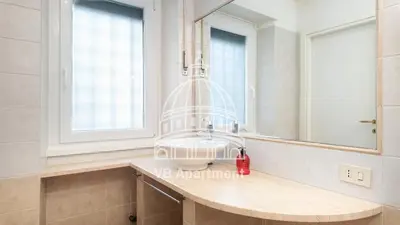 a bathroom with a sink and a mirror at Vatican-Balduina Apartment in Rome