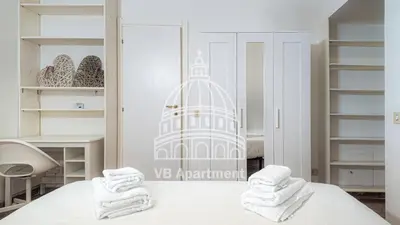 a room with a bed with towels on it at Vatican-Balduina Apartment in Rome
