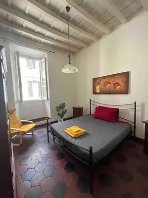 a kitchen with a sink and a white refrigerator at Historic Apartment Via dei Coronari, Piazza Navona in Rome