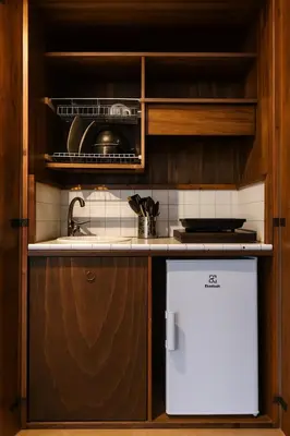 a table with two chairs and a coffee maker on it at Historic Apartment Via dei Coronari, Piazza Navona in Rome