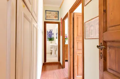 a hallway with a door and a mirror at Rome as you feel - Luxury Cappellari Apartment in Rome