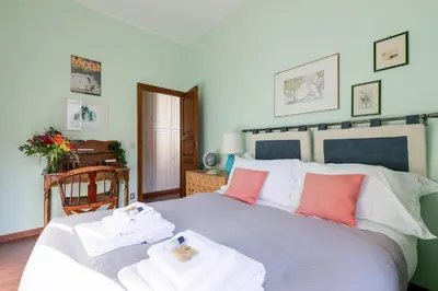 a bedroom with a bed with towels on it at Rome as you feel - Luxury Cappellari Apartment in Rome