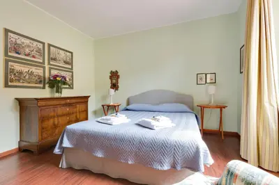 a bedroom with a bed with two towels on it at Rome as you feel - Luxury Cappellari Apartment in Rome