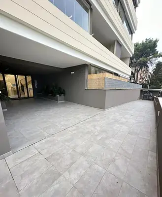 a large building with a patio in front of it at Mini appartamento vicino Trastevere in Rome