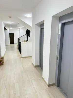 an empty hallway of an office building with a staircase at Mini appartamento vicino Trastevere in Rome