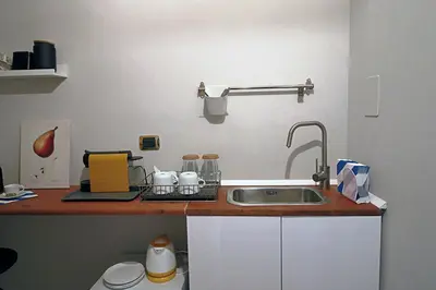 a kitchen with a sink and a counter top at Gelso in Rome