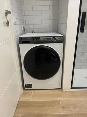 a washer and dryer in a small room at Super Comfort Pisino Street in Rome