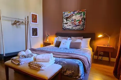 a bedroom with a large bed with towels on it at CAMERA con VISTA in Rome