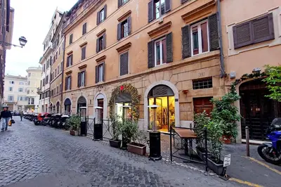 a cobblestone street in a city with buildings at Metastasio in Rome