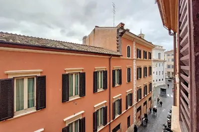 an alley in a city with buildings at Metastasio in Rome