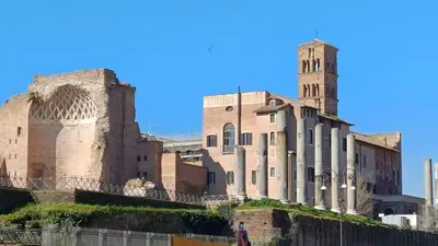 an old building with a clock tower on a hill at Chiara Stella Guest House in Rome