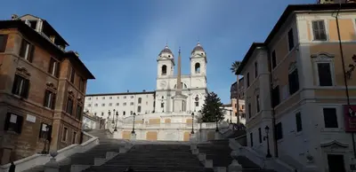 a large building with a clock tower in a city at Chiara Stella Guest House in Rome