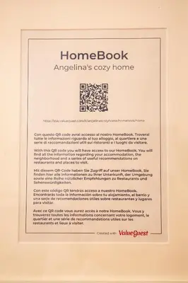 a picture of a home book with a framed document at Angelina's cozy home in Rome