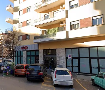 a group of cars parked in front of a building at Angelina's cozy home in Rome
