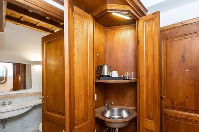 a bathroom with a sink and a toilet in it at TimeRoma Suites in Rome