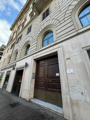 a stone building with two doors on the side of it at Cunabu Apartments in Rome
