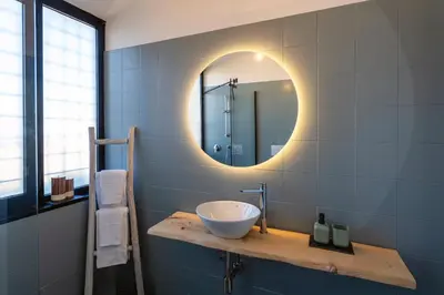 a bathroom with a sink and a mirror at LA VUE DE PAULINE in Rome