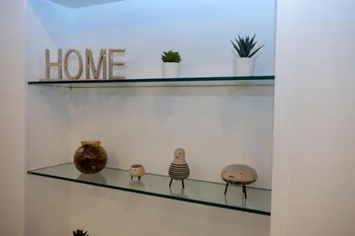 a glass shelf with some vases on it at DOMVS Ginori Testaccio in Rome