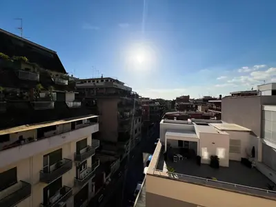 an overhead view of a city with buildings at BaccaLia Home in Rome