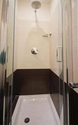 a bathroom with a shower with a tub at San Pietro's Home - Guesthouse in Rome