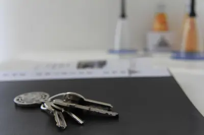 a pair of keys sitting on top of a counter at San Pietro's Home - Guesthouse in Rome